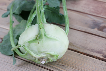 Turnip cabbage on wooden tableの写真素材