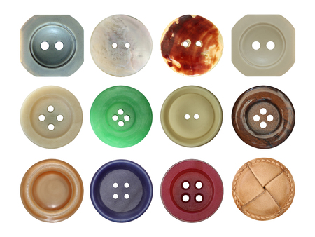Various old and used buttons on white backgroundの写真素材