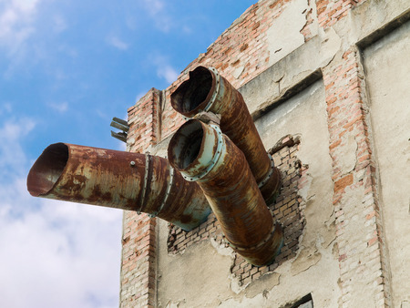 Ruins of abandoned and dilapidated factory overgrown of vegetationの写真素材