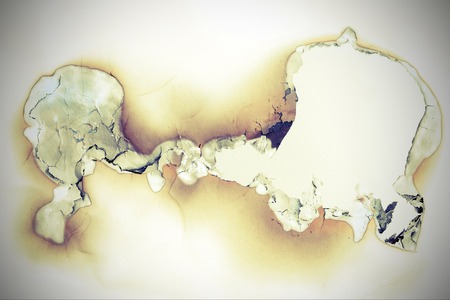 Detail of the burnt through paper in vintage styleの写真素材