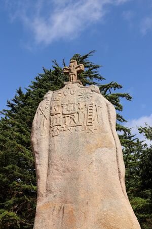 Menhir of Saint-Uzec. Menhir is about eight meters high and three meters wide. It is the largest menhir in France with Christian symbols. Pleumeur-Bodou, Brittany, France.の写真素材