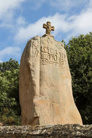 Menhir of Saint-Uzec. Menhir is about eight meters high and three meters wide. It is the largest menhir in France with Christian symbols. Pleumeur-Bodou, Brittany, France.の写真素材