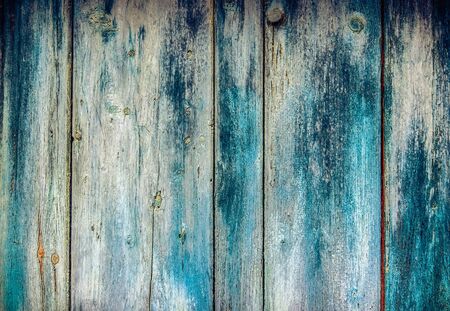 Old faded paint on wooden boards -  wooden pattern useful like vintage backgroundの写真素材