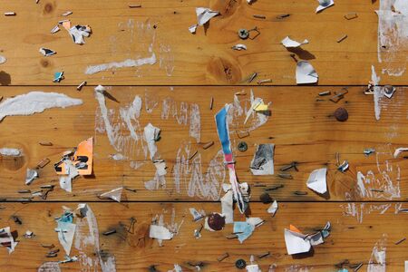 Old notice board with scraps of paper - abstract detailの写真素材