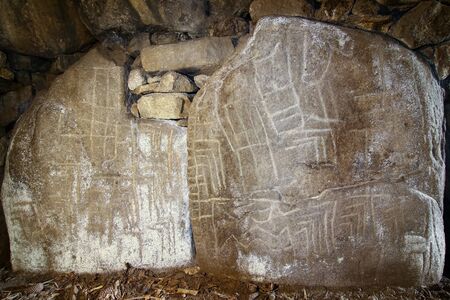 Mysterious shapes carved on a stone in one of the dolmens Mane Kerioned, Carnac, Brittany, Franceの写真素材