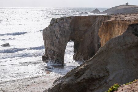 Spectacular cliffs and stone arch Arche de Port Blanc on famous coastline Cote Sauvage, Quiberon, Brittany (Bretagne), Franceの写真素材