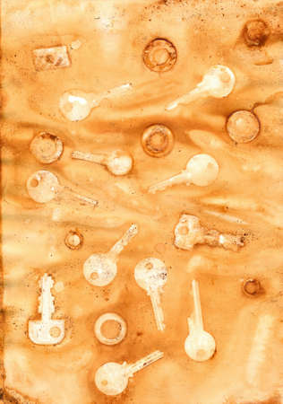 Dirty rusty paper with imprints of various keysの写真素材