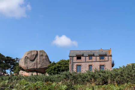 Ploumanach, France, August 7, 2019: Bouders on Pink Granite Coast - great natural site of Ploumanach, Brittany, Franceのeditorial素材