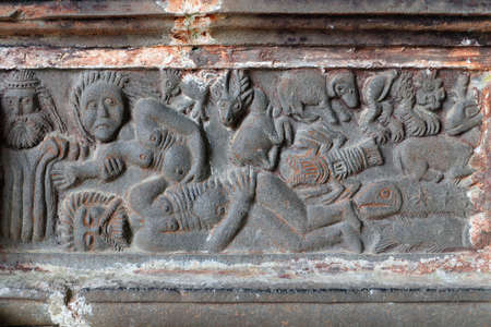 Guimiliua, France, August 8, 2019: Guimiliau Parish close - relief Creation of Eve, church...