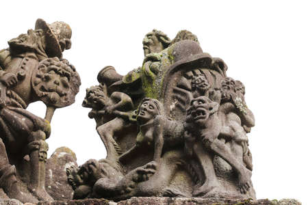 Guimiliau, France, August 8, 2019: Sinful woman in Hell - detail of scene on the Calvary in Guimiliau Parish closeのeditorial素材
