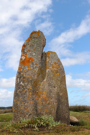 Menhir of Toeno - megalithic monument - lonely menhir on the coast at Trebeurden in Brittany, Franceの写真素材