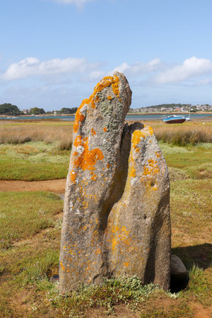 Menhir of Toeno - megalithic monument - lonely menhir on the coast at Trebeurden in Brittany, Franceの写真素材