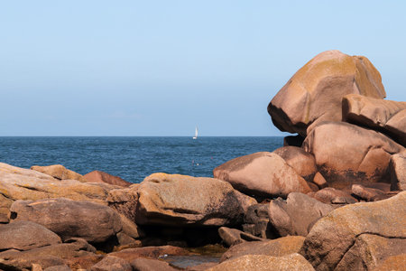Boulders on the Pink Granite Coast and Atlantic ocean - Cote de Granit Rose - great natural site of Ploumanach, Brittany, Franceの写真素材