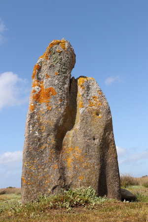 Menhir of Toeno - megalithic monument - lonely menhir on the coast at Trebeurden in Brittany, Franceの写真素材