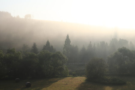 Dawn over the country side - the sun rising over the landscapeの写真素材