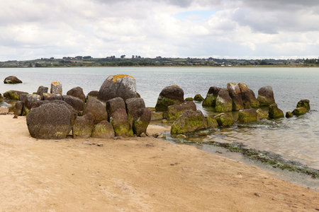 Neolithic tomb - dolmen or gallery grave also passage grave - of Guinirvit, ruins in the sea, Bay of Kernic, Plouescat, Finistere, Brittany, Franceの写真素材