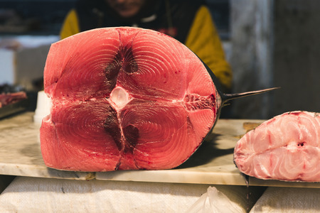 fresh swordfish on the counter of the local fish market, Catania, Italyの写真素材