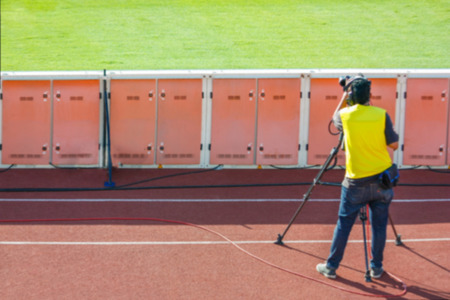 Defocused Of Cameraman Shooting Live Broadcast Soccer Match
