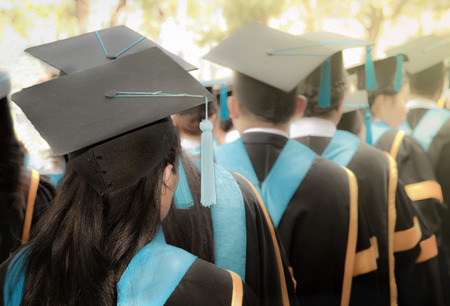 Selective focus on bachelor degree woman graduates in commencement graduation ceremony row, metaphor education, success, concept, backgroundの写真素材