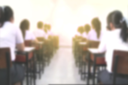 Students studying or taking examination in Classroom, university education concept background, defocus blur effectの写真素材