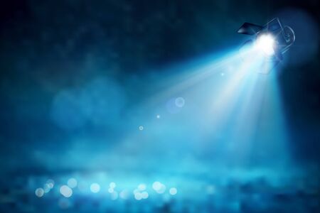 Theatrical spotlight illuminating the empty space of the stage. Blue background. Vector...