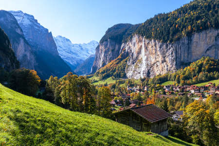 The village Lauterbrunnen (Switzerland), its valley and the waterfall Staubbach fallsの写真素材