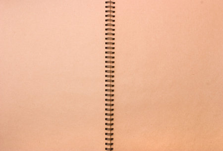 two pages of an old notebook with springの写真素材