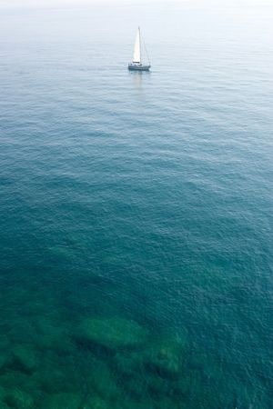 sailing boat in the limpid water of the Mediterranean - Cinque Terre - Italyの写真素材