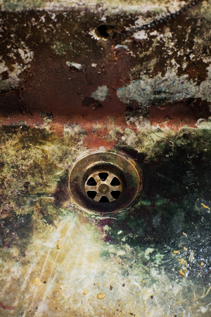 old disgusting dirty colourful drain in ancient industryの写真素材