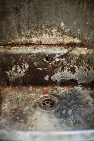 old disgusting dirty colourful drain in ancient industryの写真素材