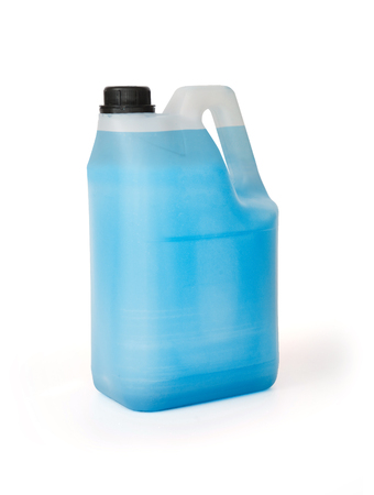 plasti tank full of blue chemical liquid isolated on white backgroundの写真素材