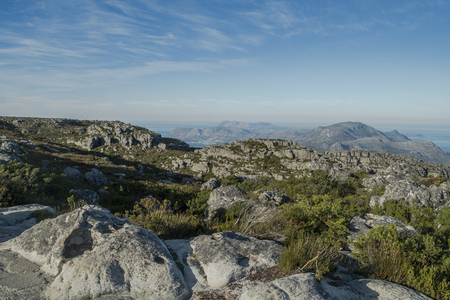 Rocks with vegetation on table mountainの写真素材