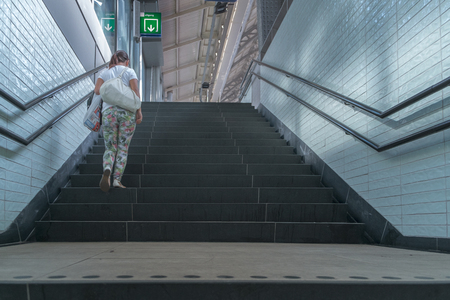 Girl climbing subway stairsのeditorial素材