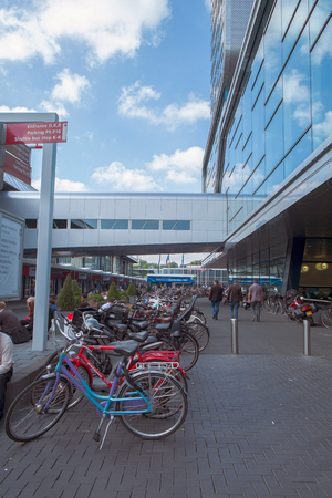 Street of amsterdam city with mirrored building and bicyclesのeditorial素材