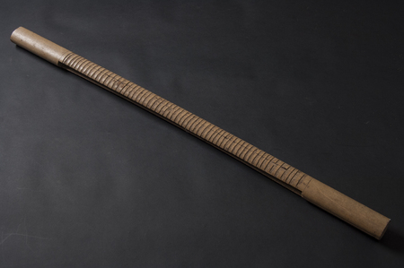 African handmade music instrument isolated on dark backgroundの写真素材