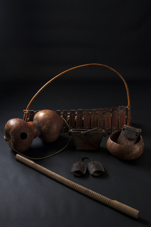 Set of african musical instruments isolated on dark backgroundの写真素材