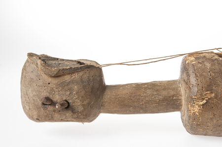 African music instrument with a face, made wooden, isolated on white backgroundの写真素材