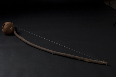 African instrument made by hand, African berimbau, isolated on black backgroundの写真素材