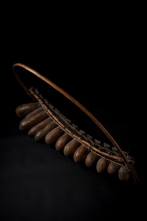 African music instrument, wooden marimba with two bakets, isolated on dark backgroundの写真素材