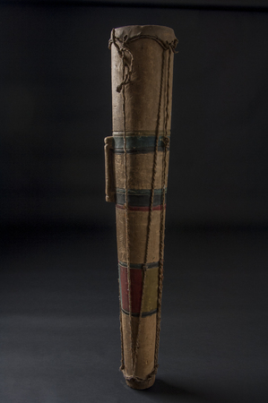 Handmade african instrument, wooden drum, isolated on black backgroundの写真素材