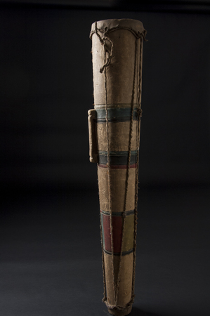 Handmade african instrument, wooden drum, isolated on black backgroundの写真素材