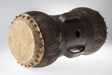 African music instrument, drum made of wood, isolated on white backgroundの写真素材