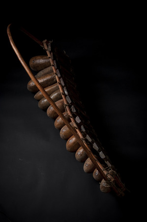 African music instrument, wooden marimba with two bakets, isolated on dark backgroundの写真素材