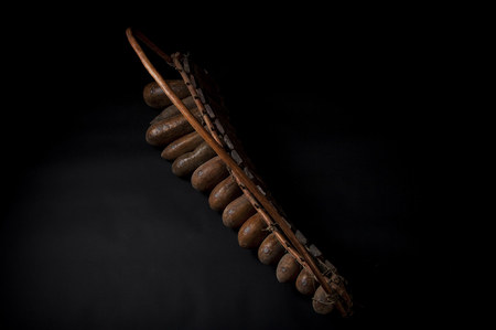African music instrument, wooden marimba with two bakets, isolated on dark backgroundの写真素材