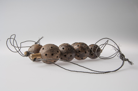 African handmade instrument, rattle isolated on white backgroundの写真素材