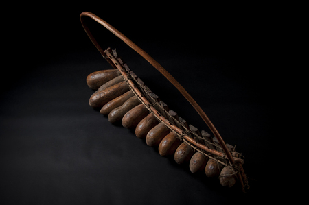 African music instrument, wooden marimba with two bakets, isolated on dark backgroundの写真素材
