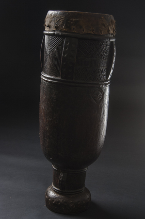 Handmade african instrument, wooden drum, isolated on black backgroundの写真素材