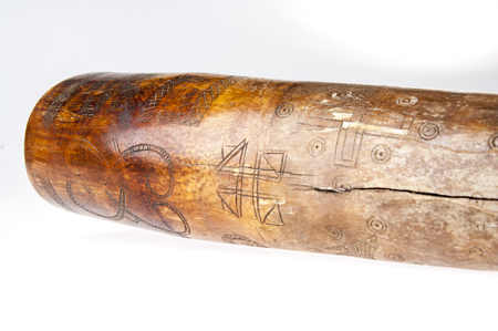 African music instrument, trumpet with African symbols, handmade, isolated on white backgroundの写真素材