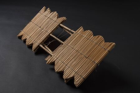 Hand made african instrument, wooden pipes, isolated on black backgroundの写真素材