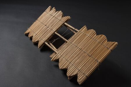 Hand made african instrument, wooden pipes, isolated on black backgroundの写真素材